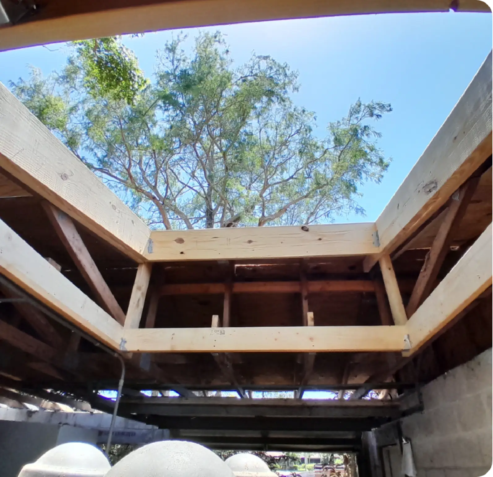East Pointe Country Club new wood roof framing open to sky