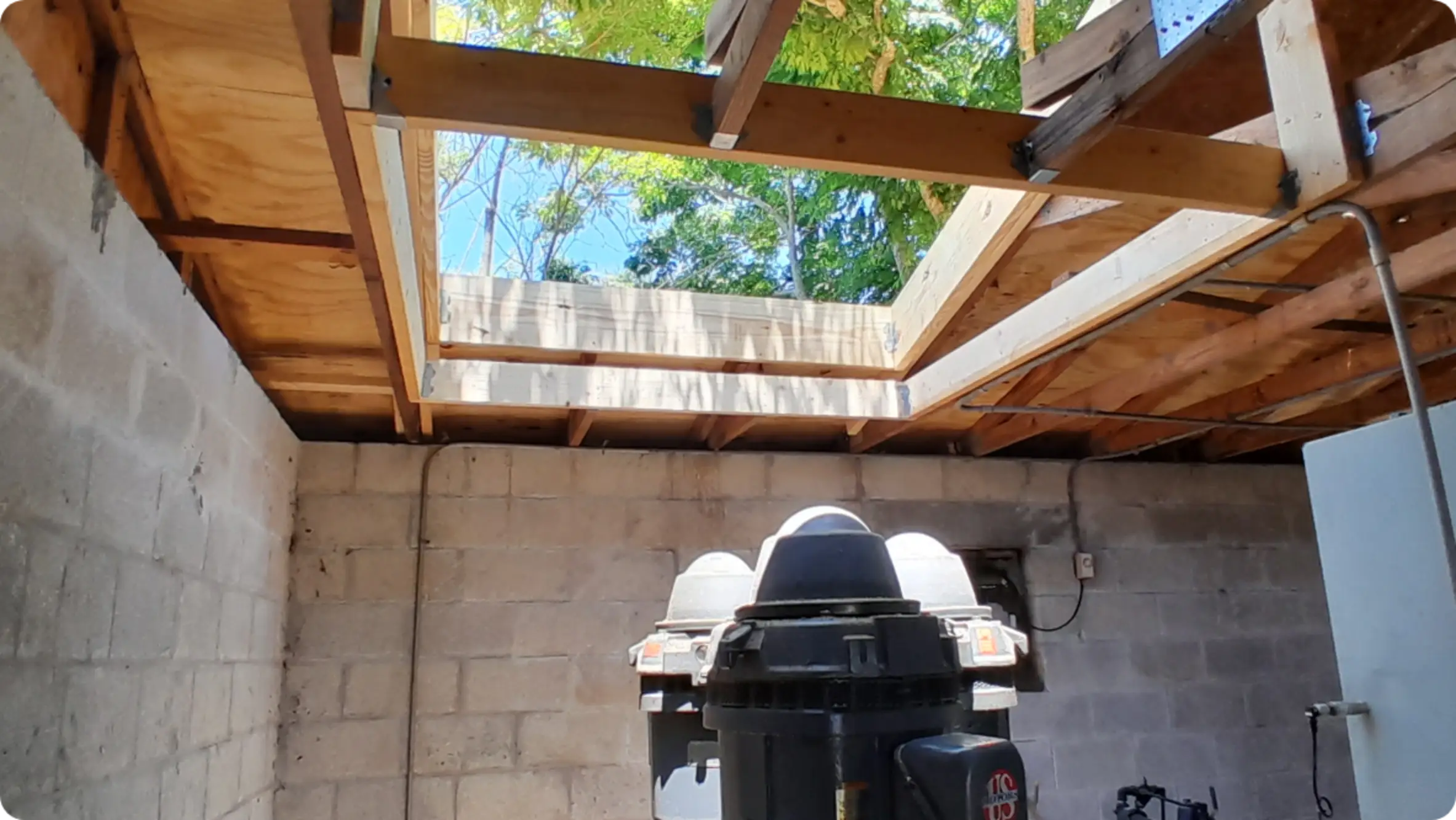 East Pointe Country Club wood-framed roof opening above block walls
