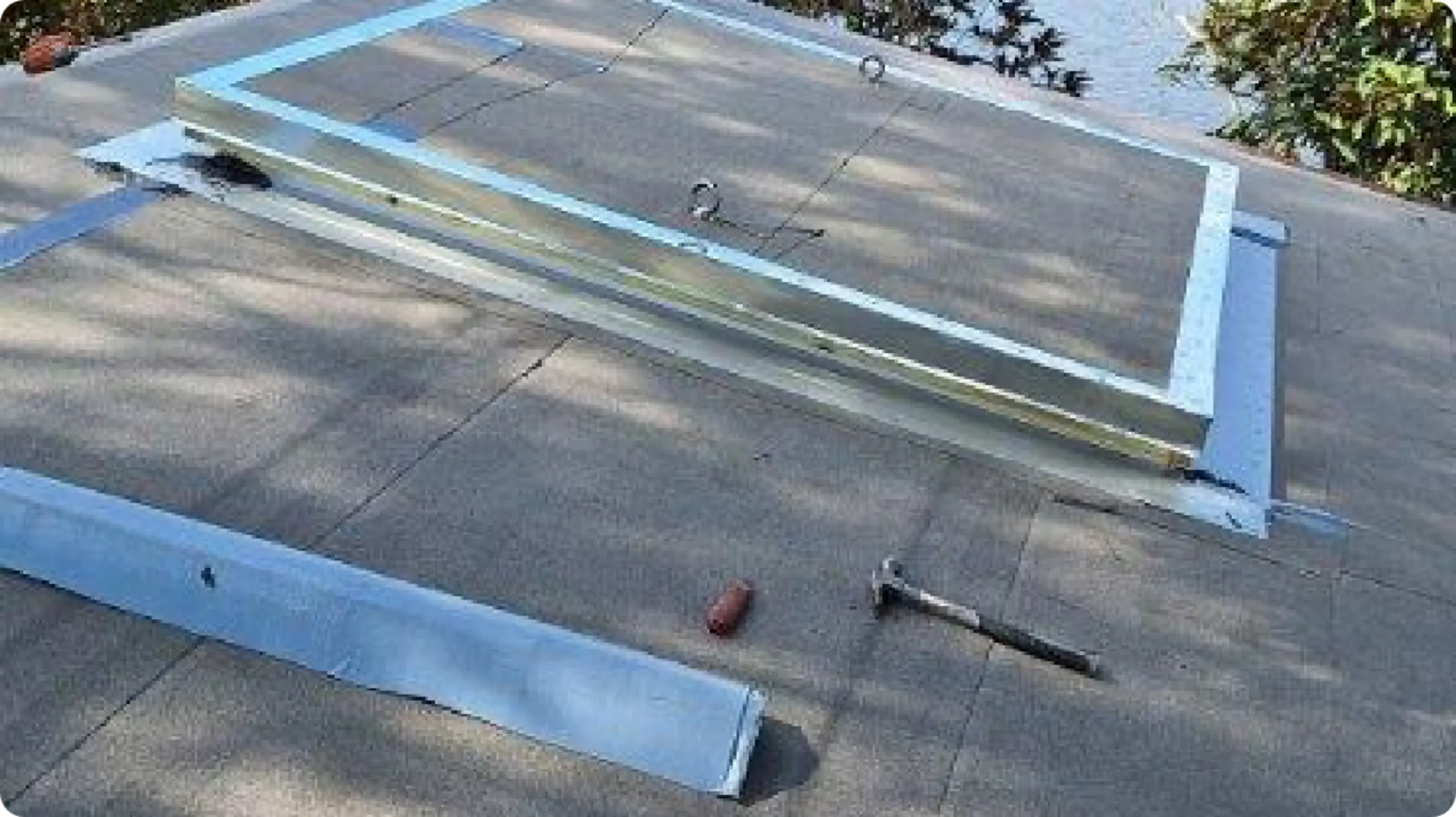 East Pointe Country Club flat roof with metal curb frame and hammer