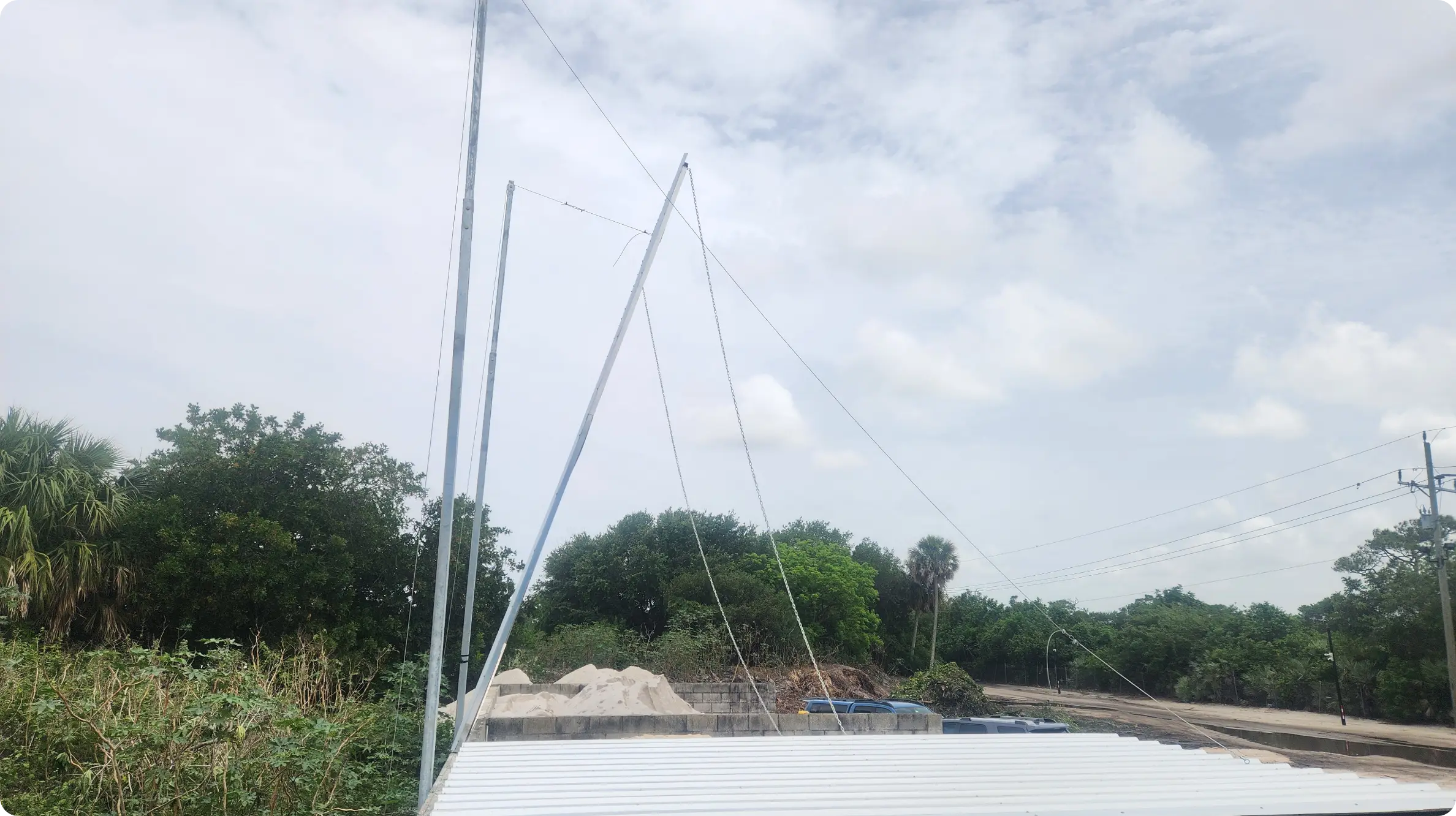 Steel framing posts being raised for soil bin cover structure