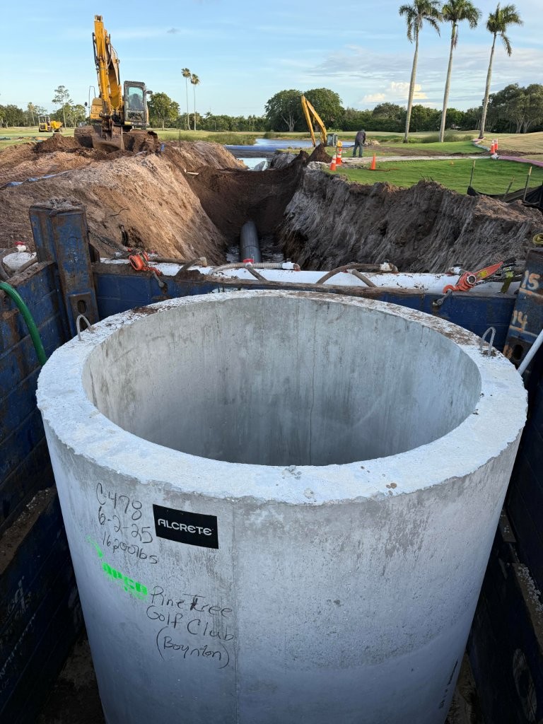 Precast concrete wet well section set for golf course pump station.