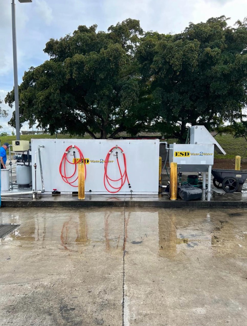 ESD Wash 2 Water equipment wash system with red hoses outdoors