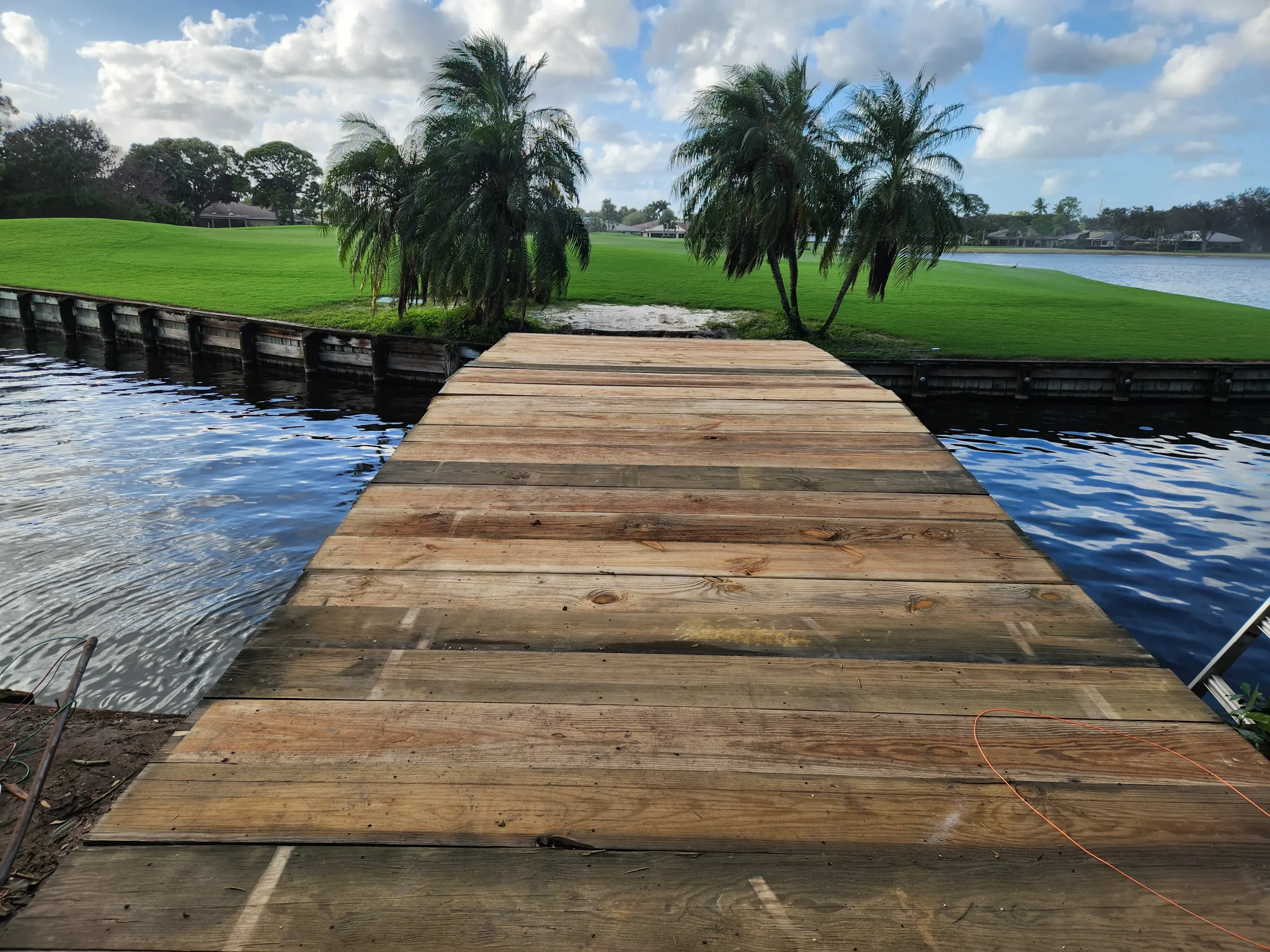 East Point new wood plank bridge walkway over water between fairways