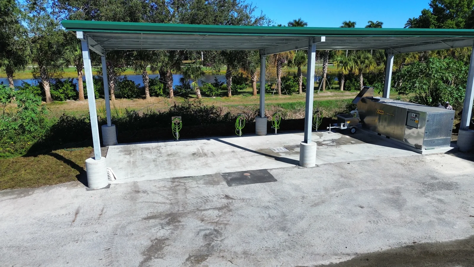 Finished covered wash pad at Hole in the Wall Golf Club with wash-water containment system in place