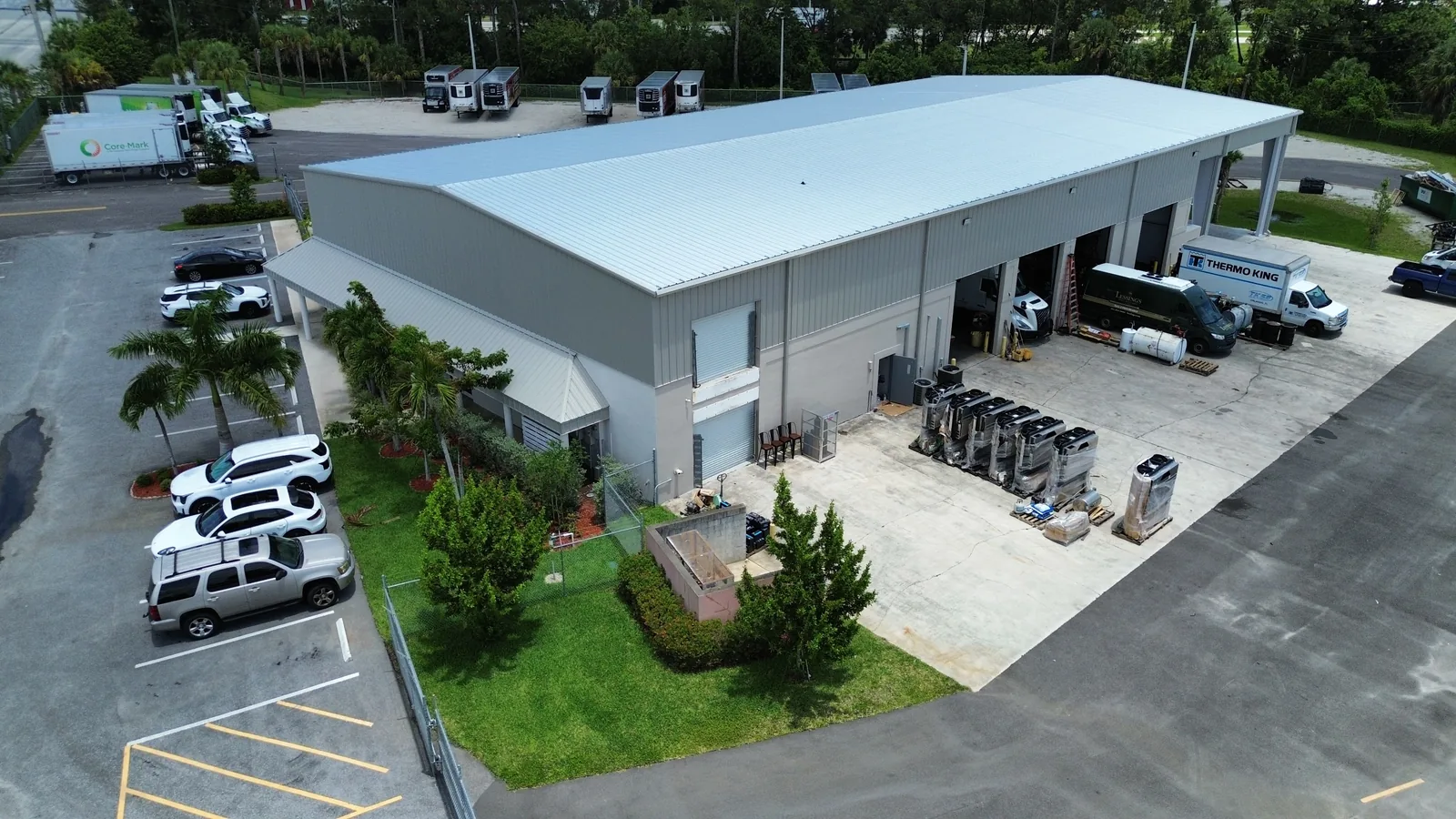 Aerial view of the completed Thermo King facility showing the extended footprint, new roof, and covered wash bay.