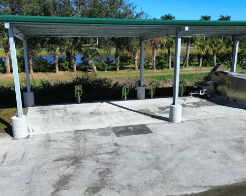 Finished covered wash pad at Hole in the Wall Golf Club with wash-water containment system in place