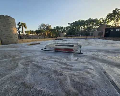 Freshly poured and finished concrete wash pad slab with column footings in place