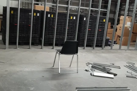 Thermo King facility interior with steel stud framing and battery cabinets under construction