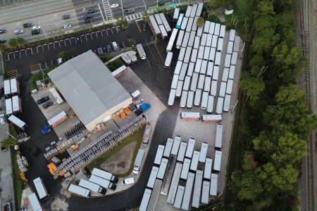 Overhead view of warehouse, parking lot, and rows of trailers