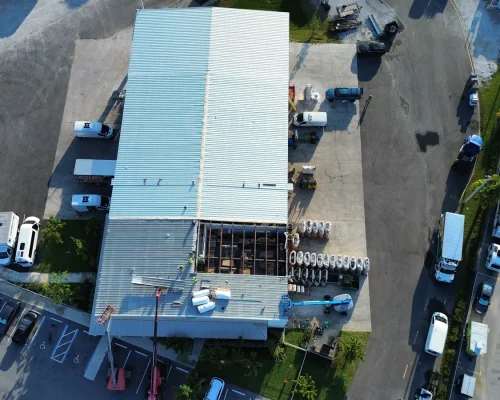 Overhead view of the new roof structure on the Thermo King building extension, fresh metal decking spanning the steel framing.